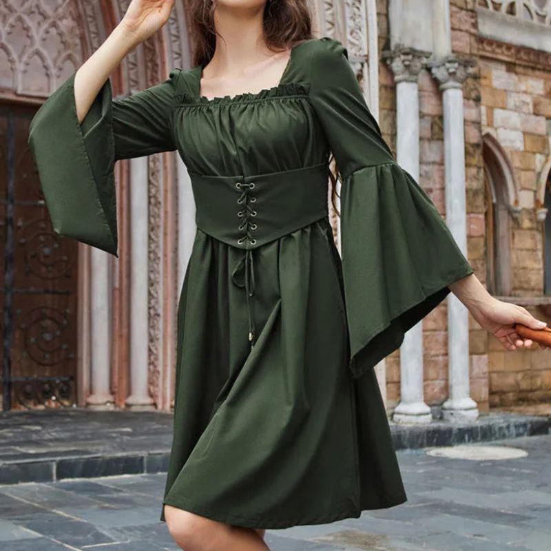 woman wearing a green fairy dress with integrated corset and large sleeves