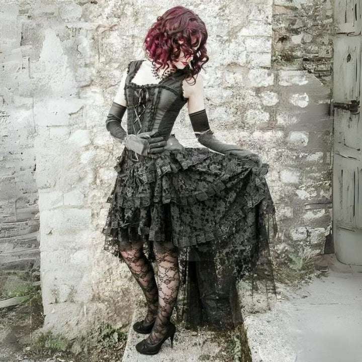 woman with red hair wearing a black gothic steampunk dress