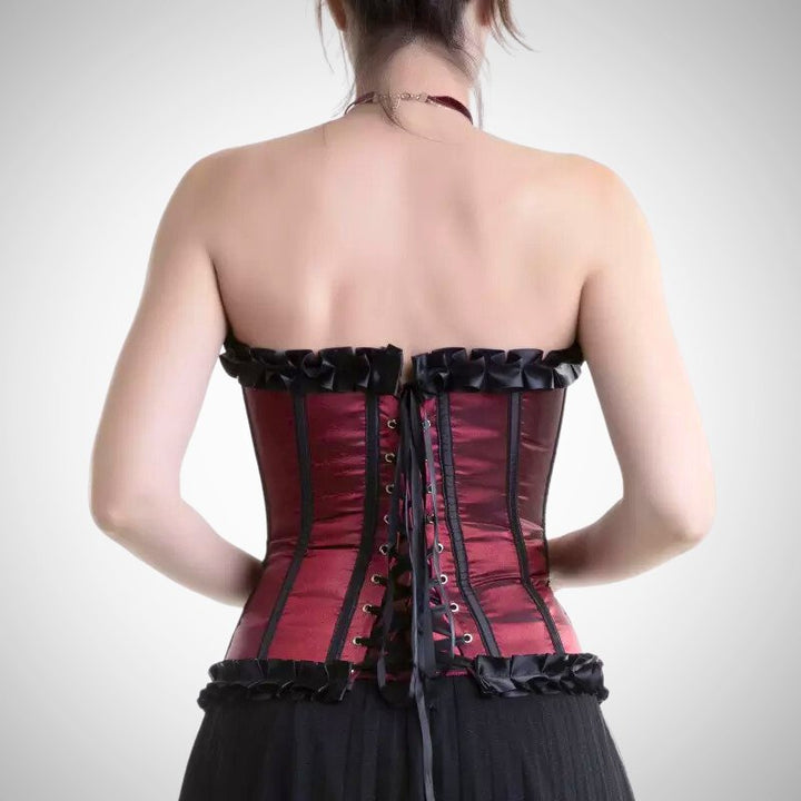 woman wearing a black and red corset laced at the back