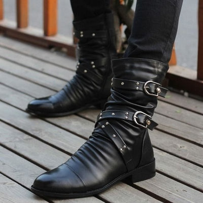close-up of man wearing black steampunk boots 