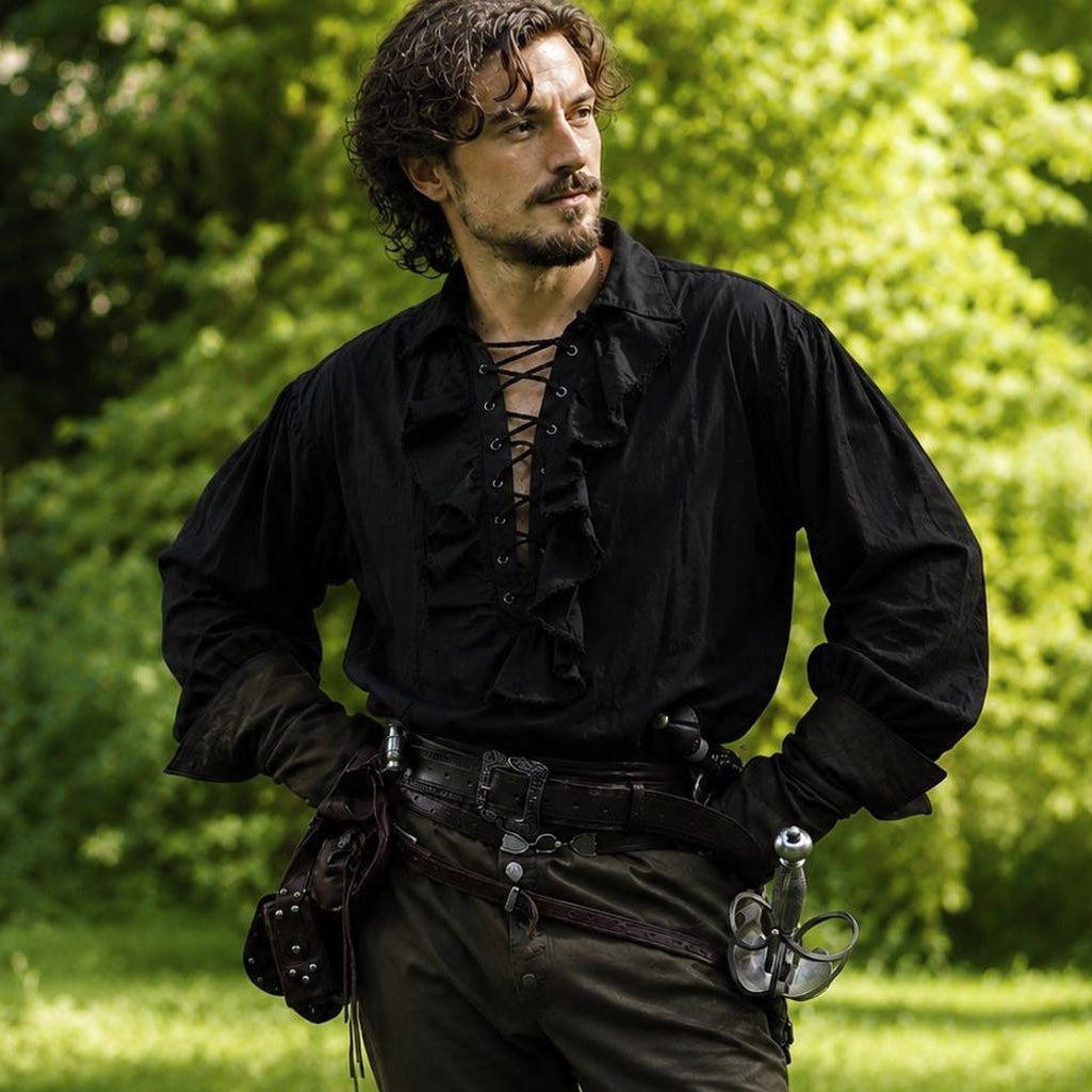 man wearing a black ruffle shirt in a pirate style