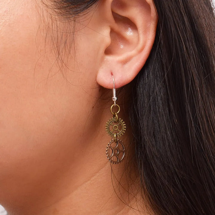 steampunk earrings with two cogs on ear
