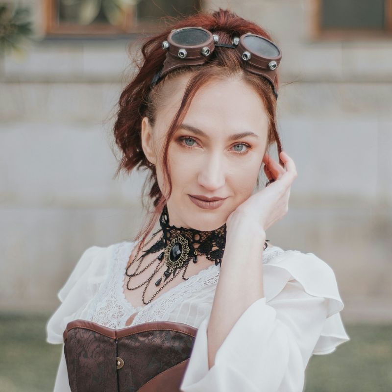 woman wears a steampunk gothic necklace 