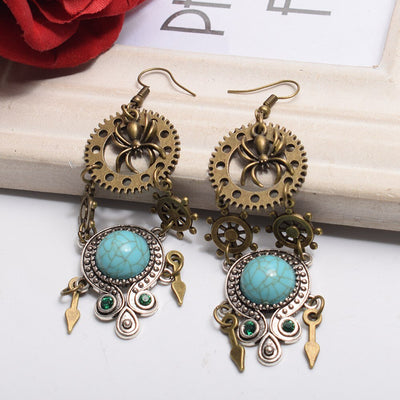 steampunk earrings with blue rock and spider