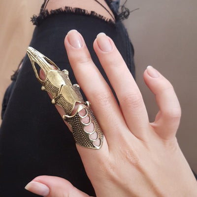 steampunk finger armor on woman's hand