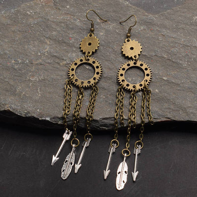 steampunk earrings on rock